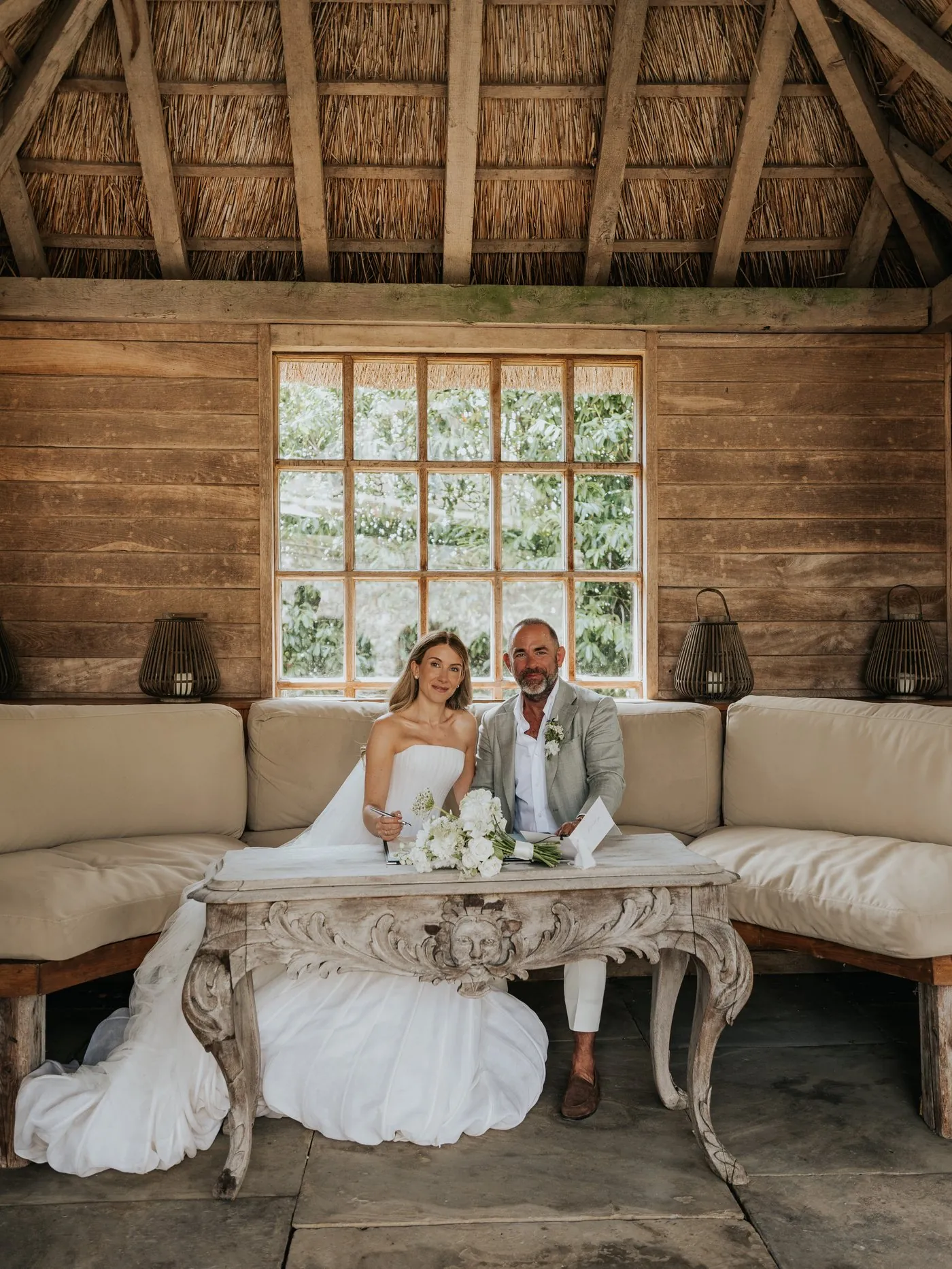 A bride and groom during the speeches at their wedding breakfast